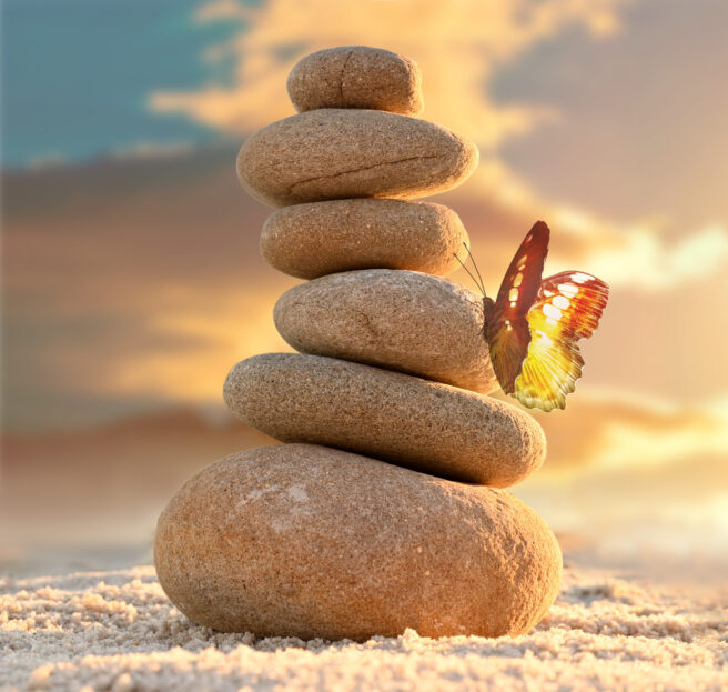 Stone tower. Natural pebble stone on the beach. Balancing body, mind, soul and spirit. Mental health.